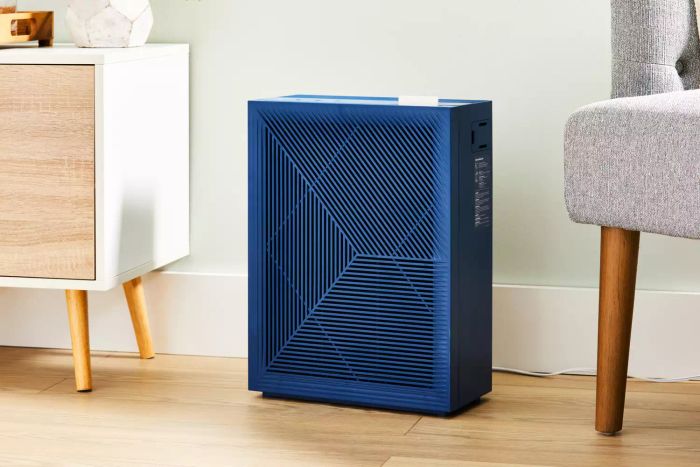 The Coway Airmega 160 Air Purifier placed on a wooden floor