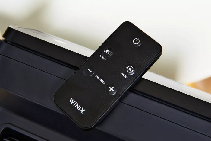 A close-up view of the remote control for the Winix 5500-2 4-Stage True HEPA Air Purifier.