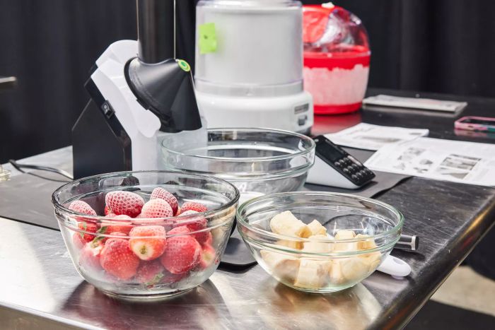 Bowls filled with fruit, ready to be used in an ice cream maker.