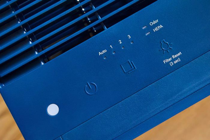 A close-up shot of the buttons on the Coway Airmega 160 Air Purifier