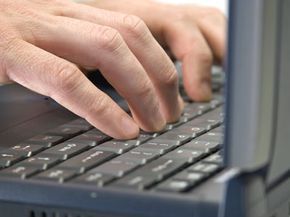person typing on a keyboard
