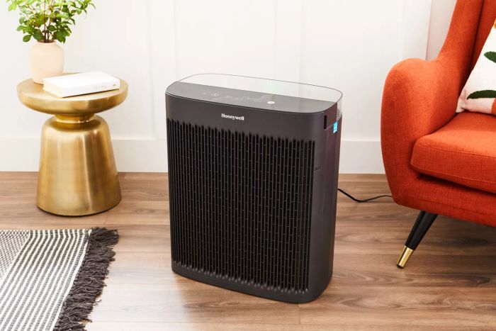 The Honeywell HPA5300 InSight HEPA Air Purifier placed on a wooden floor for display.
