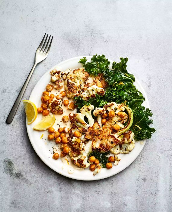 Cauliflower Steaks with Kale, Crispy Chickpeas, and Tahini Dressing