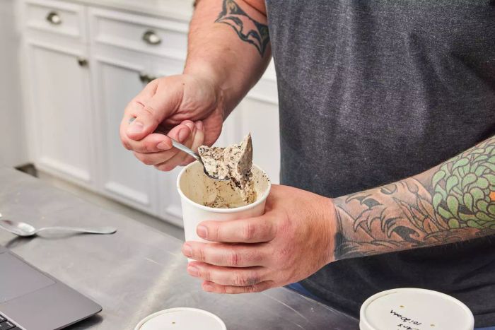 A person holds a spoon filled with ice cream from the Chef'n Sweet Spot Ice Cream Maker.