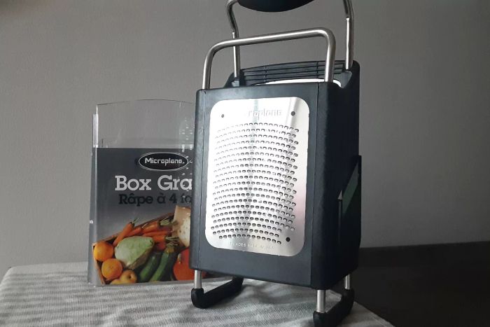 Microplane Specialty Series 4-Sided Box Grater resting on a kitchen towel