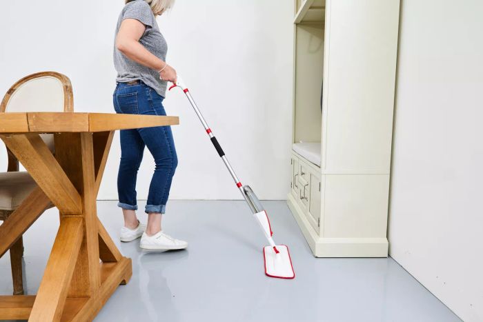 individual mopping floor with the Panda Grip Microfiber Spray Mop