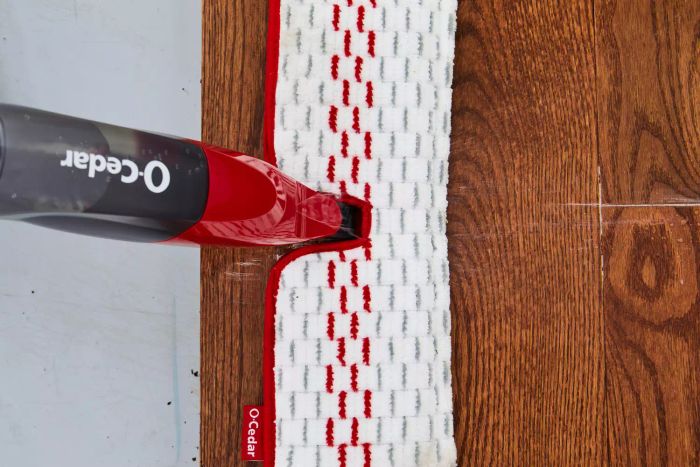 close-up view of O-Cedar ProMist MAX Microfiber Spray Mop cleaning a wood floor