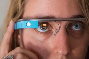 In 2013, a woman demonstrates Google Glass at an event.