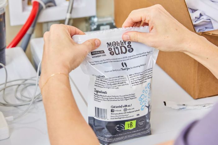 Sealing the bag of Molly's Suds Unscented Laundry Detergent Powder