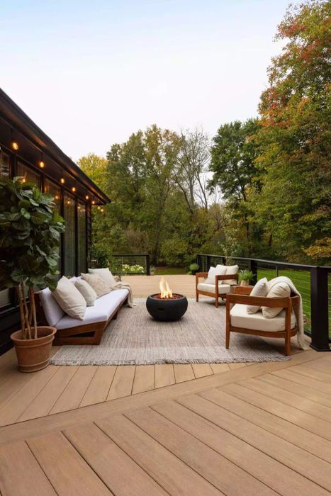 deck with outdoor furniture and a fire pit