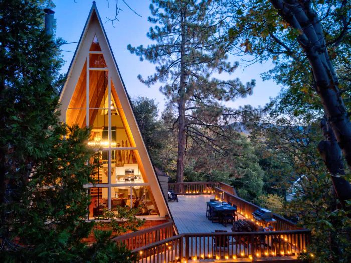 Deck in the woods with lights around the perimeter