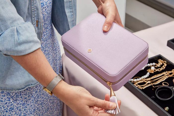 A person holding the Kendra Scott Medium Travel Jewelry Case