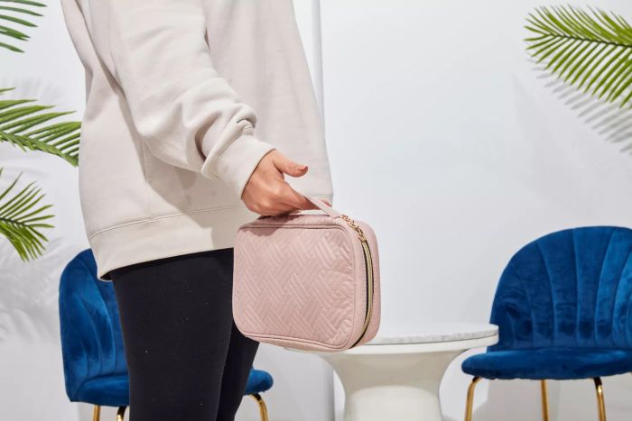 A person holding the Bagsmart Jewelry Organizer Bag