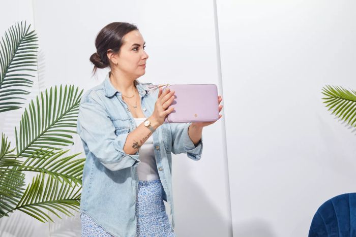 A person holding the Kendra Scott Medium Travel Jewelry Case