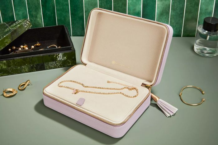 Kendra Scott Medium Travel Jewelry Case displayed on a green tabletop