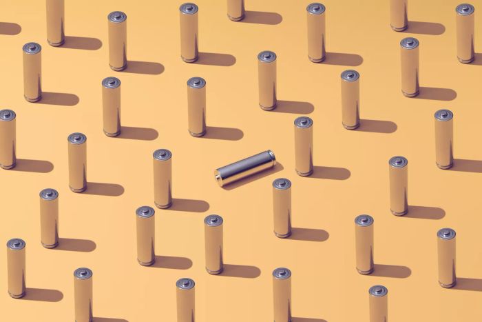 A collection of batteries arranged against a vibrant backdrop, symbolizing standing out from the rest
