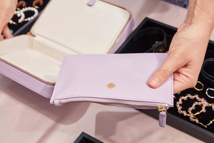 A person holding the Kendra Scott Medium Travel Jewelry Case
