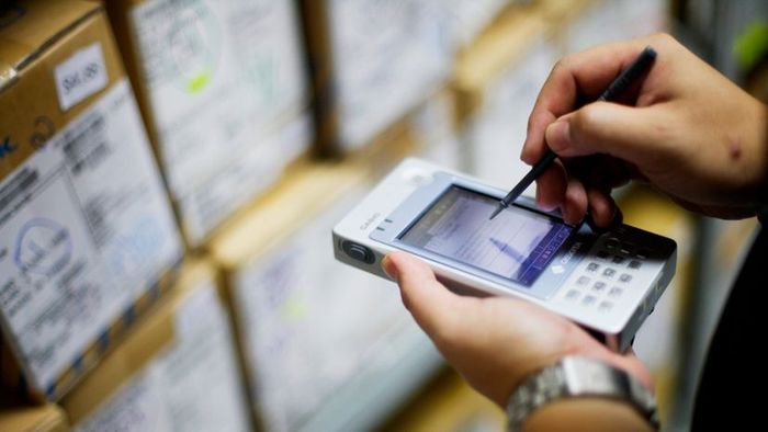 A person using a PDA device.