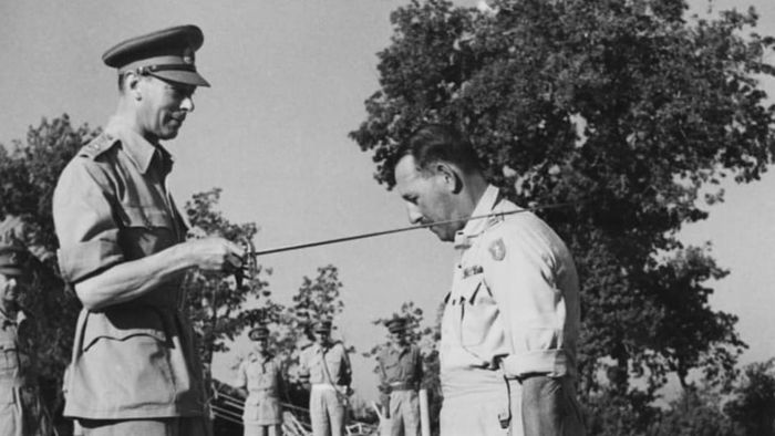 Lieutenant General Sir Oliver Leese of the British Army is knighted by King George VI during the King's visit to the Eighth Army in Italy in 1944.
