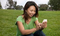 Woman interacting with a smartphone