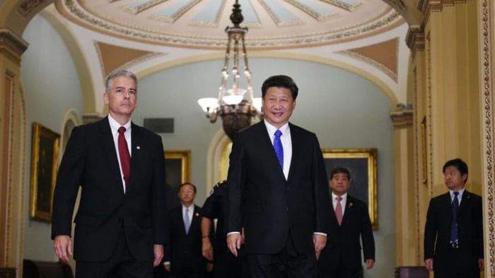 Senate Sergeant at Arms Frank Larkin (L) accompanies China’s President Xi Jinping during his visit to Capitol Hill.