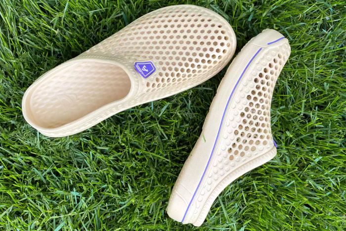 Amoji Garden Clogs displayed on grass