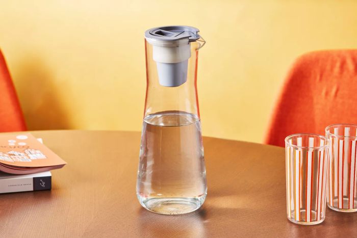 The Hydros Glass Slim Pitcher placed on a table