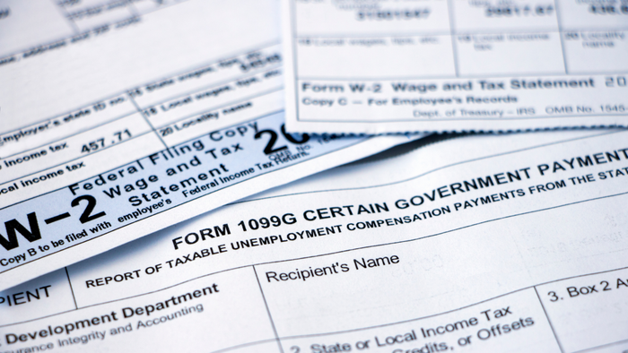 A stack of W-2s, 1099s, and other necessary tax forms