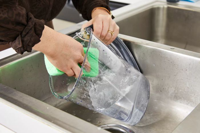 A person cleaning the Brita Rapids Stream Water Pitcher