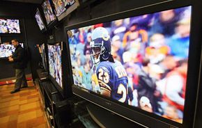 A customer examines HDTVs at a Circuit City store in New York City on January 29, 2008.