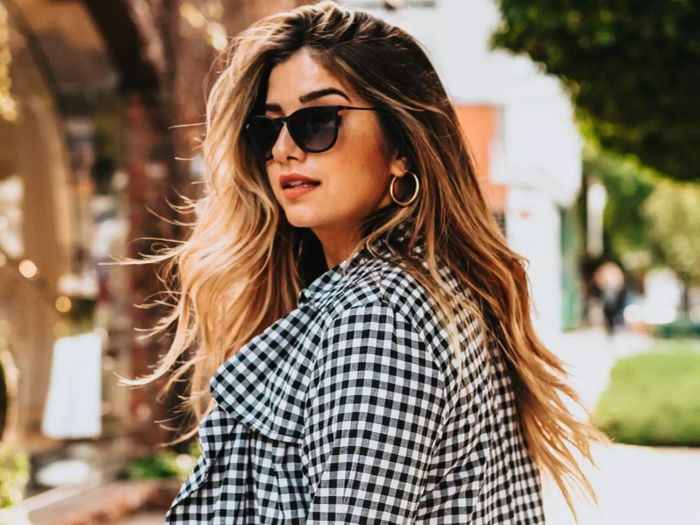 woman showcasing balayage hair highlights