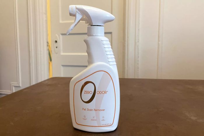 Zero Odor Pet Stain Remover & Odor Eliminator spray positioned on a wooden surface