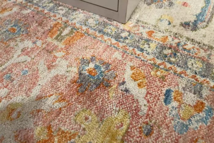 A close-up view of a rug that has been cleaned using Zero Odor Pet Stain Remover & Odor Eliminator spray