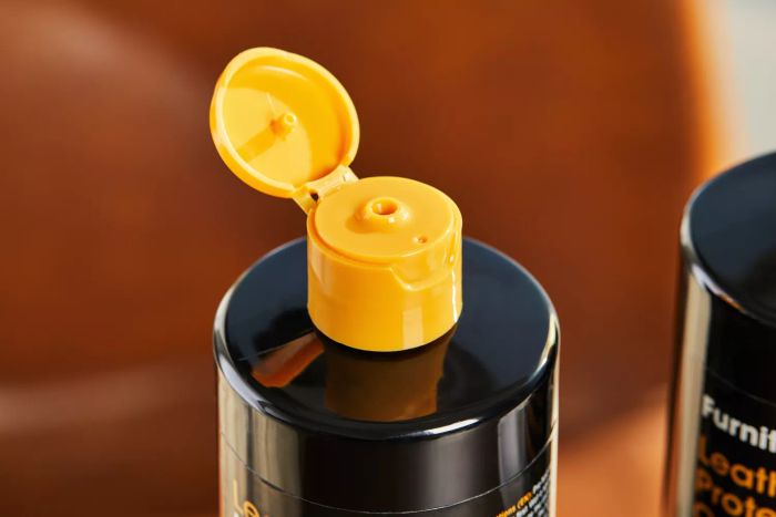 A close-up shot of the open cap of the Furniture Clinic Large Leather Care Kit bottle.