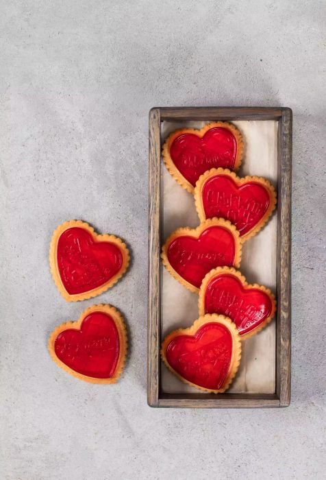Holiday Cookies decorated with strawberry jelly, heart-shaped