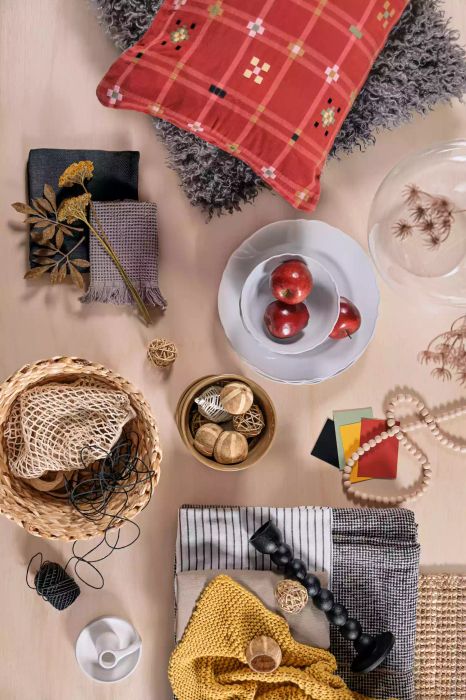 Aerial view of decor items, throw pillow, rug, and textiles