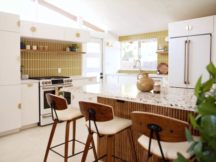 white kitchen with yellow-tiled backsplash