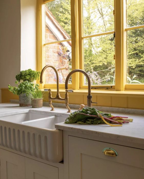 kitchen with yellow-painted window trim