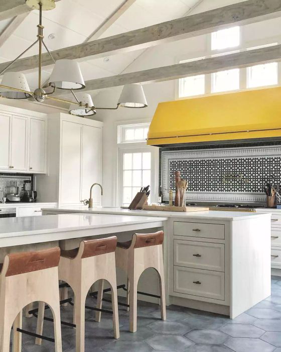 Industrial-style kitchen with yellow range hood