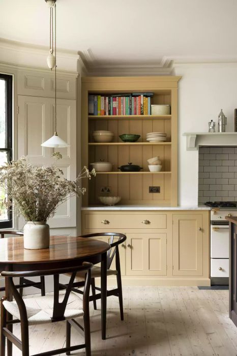 Kitchen with yellow-beige painted cabinets