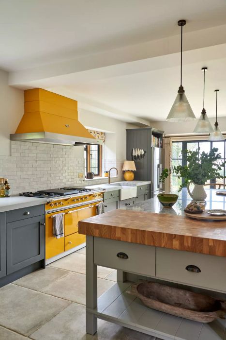 kitchen featuring a yellow stove and range hood