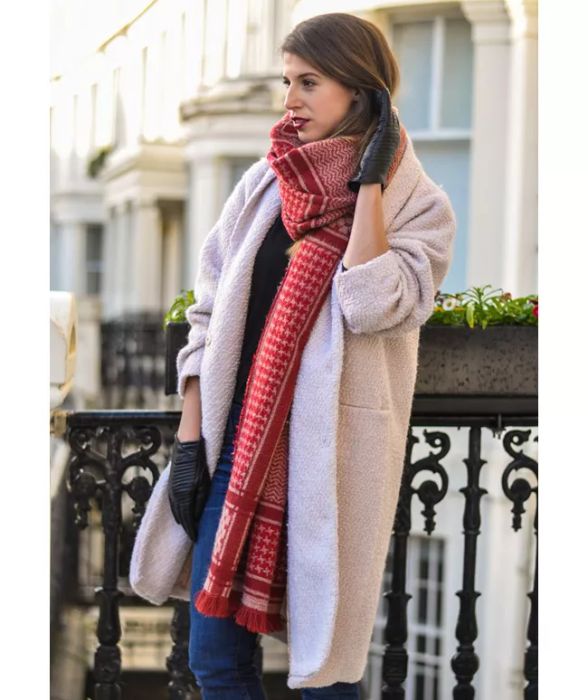 You can wear a blanket scarf with one unevenly hanging tail.