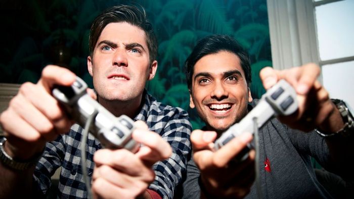 Two gamers enjoying a match on an Xbox console.
