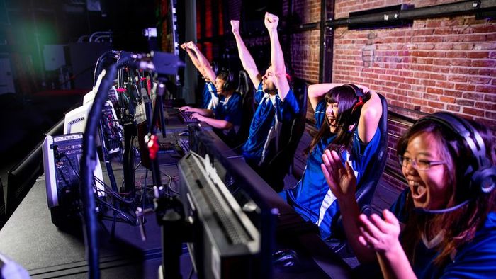 A group of teens immersing themselves in video game action