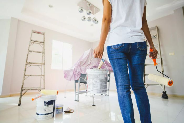 Women getting ready to paint a room