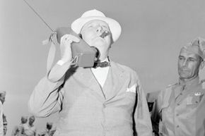 In June 1942, Prime Minister Winston Churchill can be seen using a walkie-talkie during his visit to Fort Jackson.