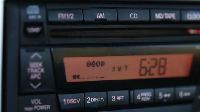 A car radio showing the station's code.