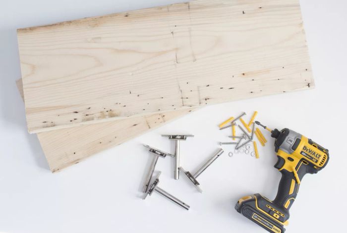 Materials required for constructing your floating shelf (pine board, drill, brackets)