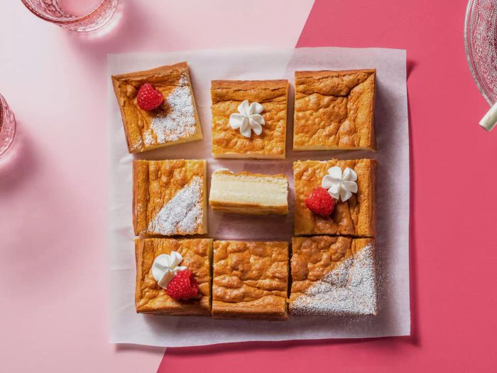 Overhead shot of several slices of cake on parchment paper