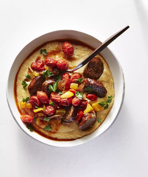 Old Bay Cheddar Grits with Andouille and Tomatoes